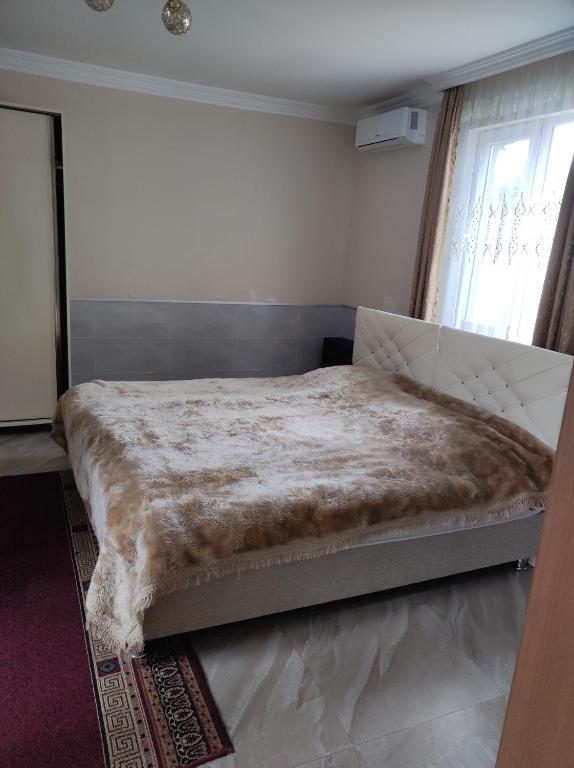 Postel nebo postele na pokoji v ubytování Guest House Koba