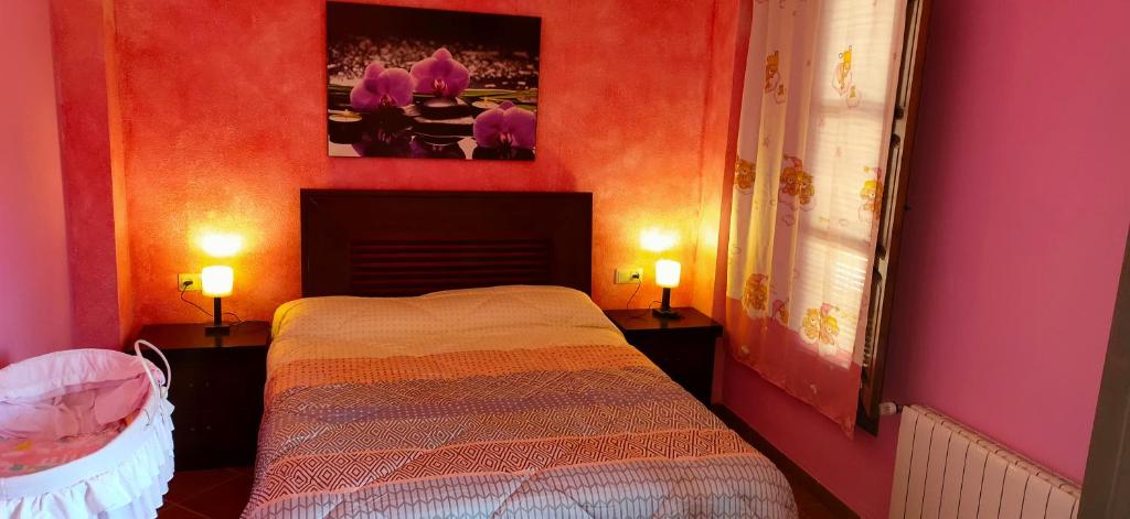Łóżko lub łóżka w pokoju w obiekcie cortijo los arcos