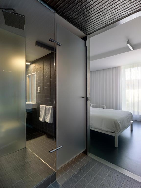 Postel nebo postele na pokoji v ubytování Moure Hotel