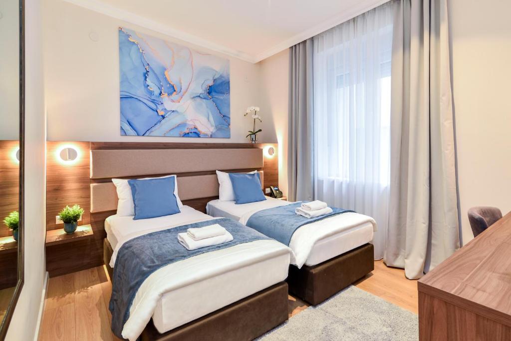 Krevet ili kreveti u jedinici u okviru objekta Hotel Opera Garni