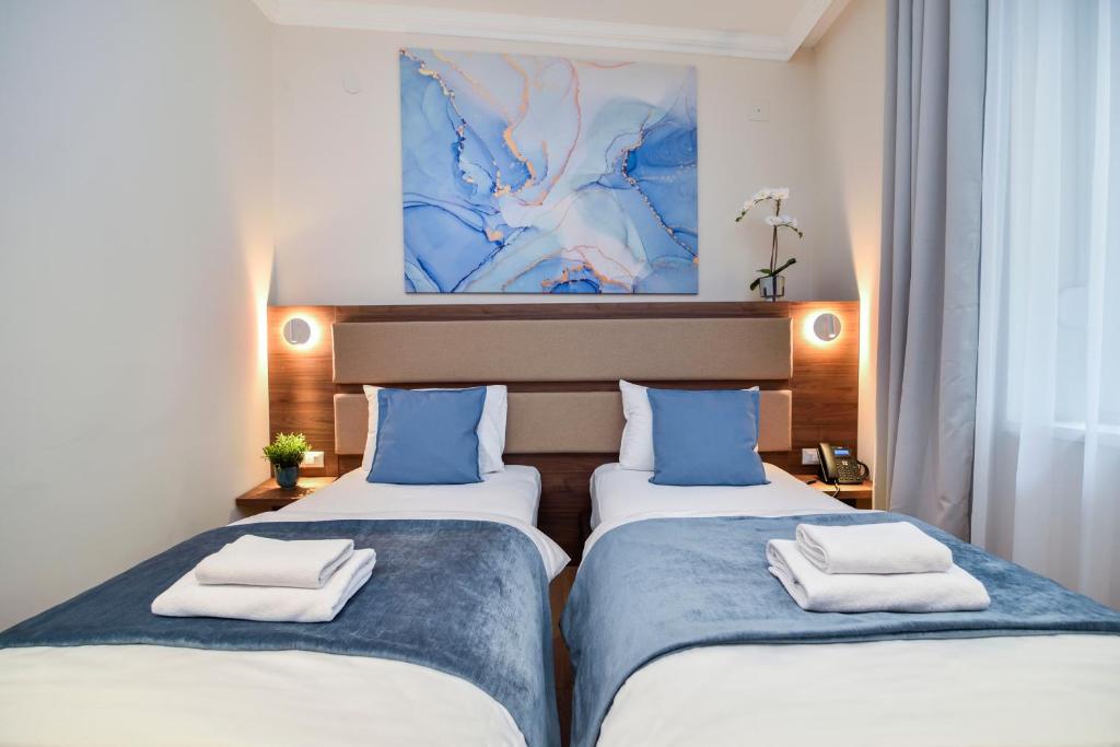 Krevet ili kreveti u jedinici u okviru objekta Hotel Opera Garni