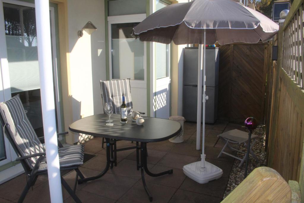 Patio nebo venkovní prostory v ubytování WH FEWO am Deich