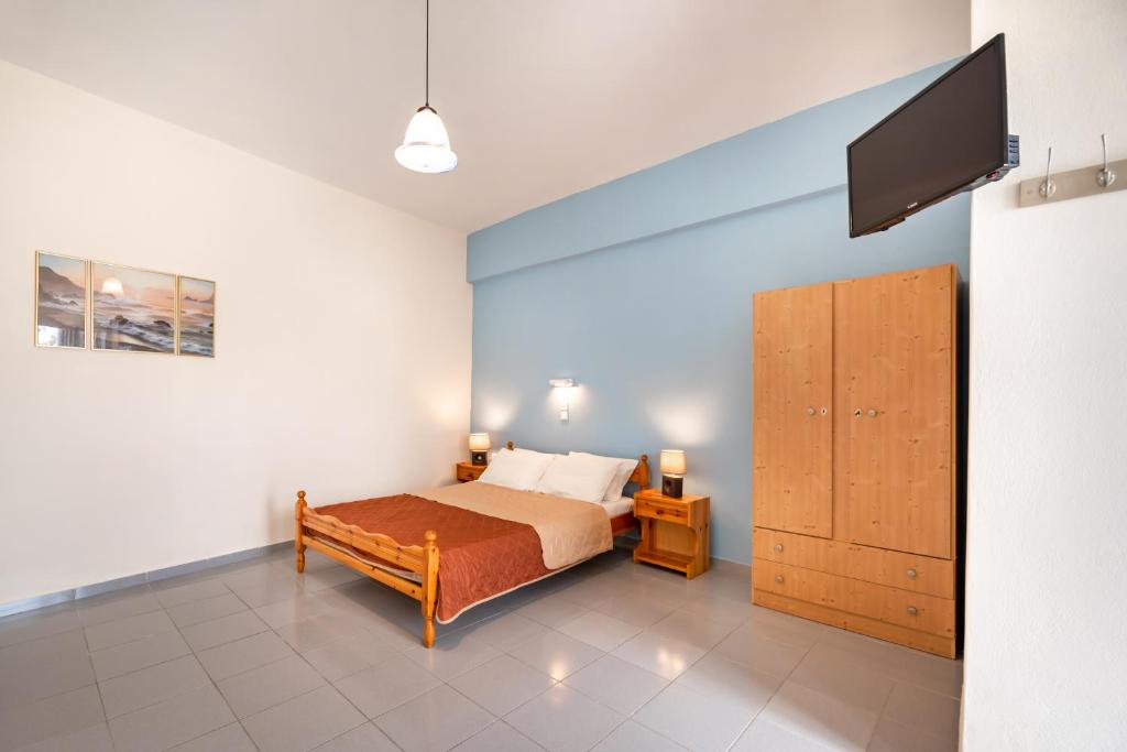 Łóżko lub łóżka w pokoju w obiekcie Onar Rooms & Studios