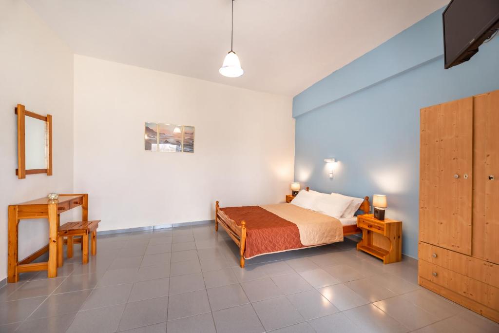 Łóżko lub łóżka w pokoju w obiekcie Onar Rooms & Studios