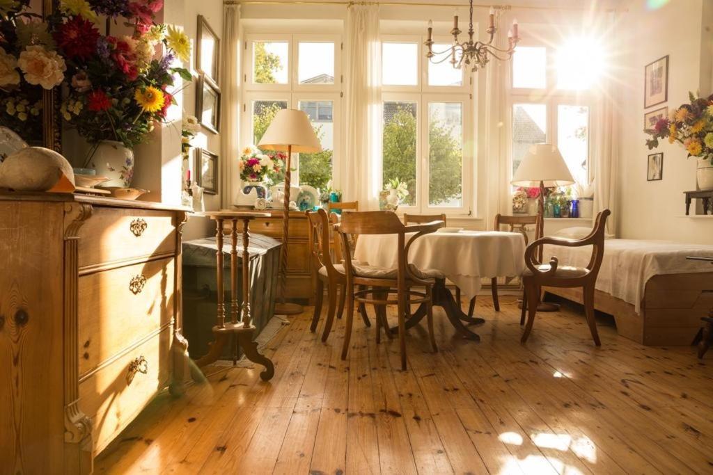 a kitchen and dining room with a table and chairs at Villa Anna in Zinnowitz