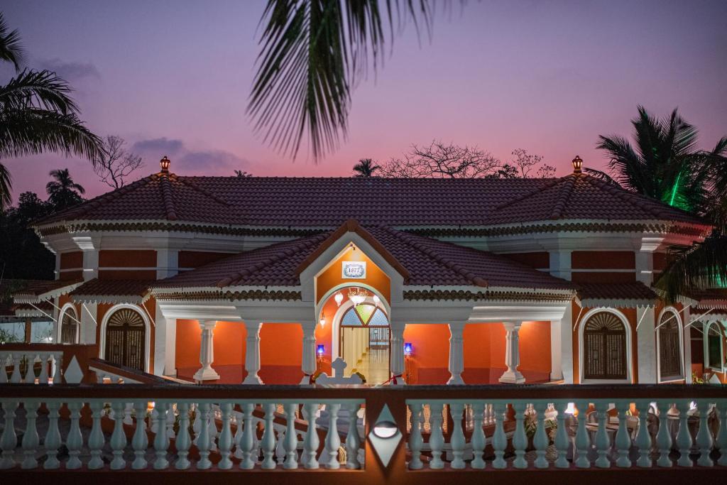 a house with a fence in front of it at Casa Albuquerque in Vagator