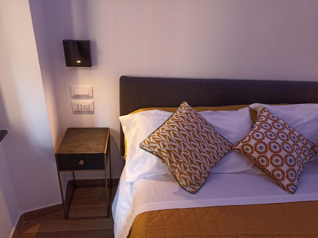 Кровать или кровати в номере Al Porto 61 - Rooms for Rent