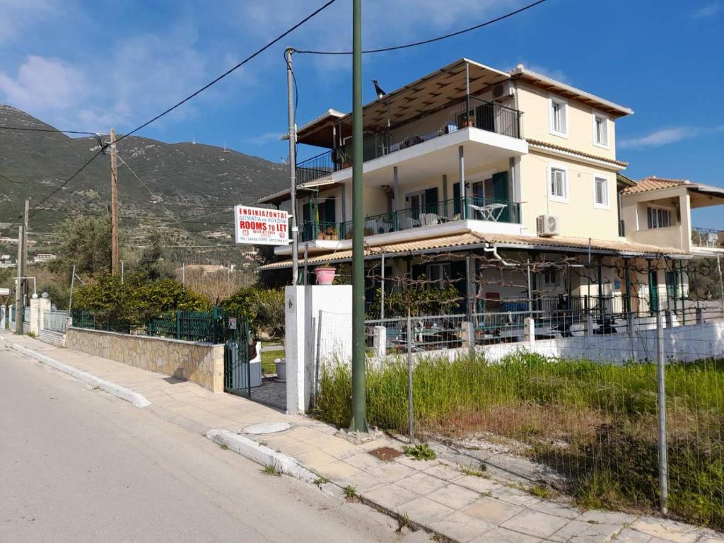 a building is under construction on the side of a street at Zotos Studios in Vasiliki