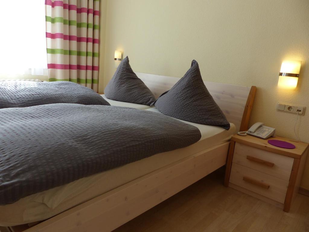 Postel nebo postele na pokoji v ubytování Hotel Theile garni
