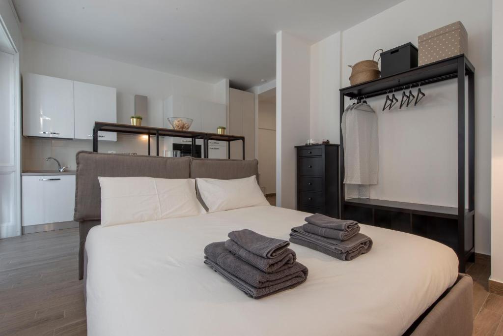 A bed or beds in a room at Gaffurio Apartments
