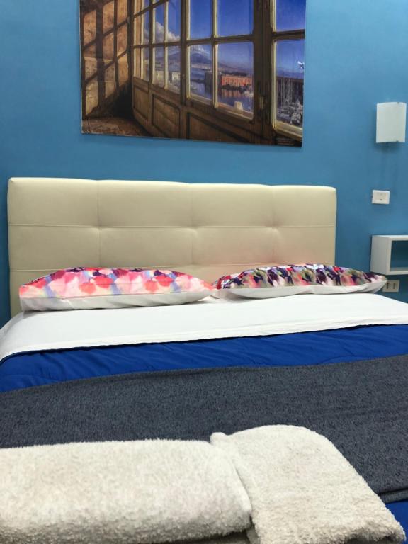 A bed or beds in a room at Decumani Prestige