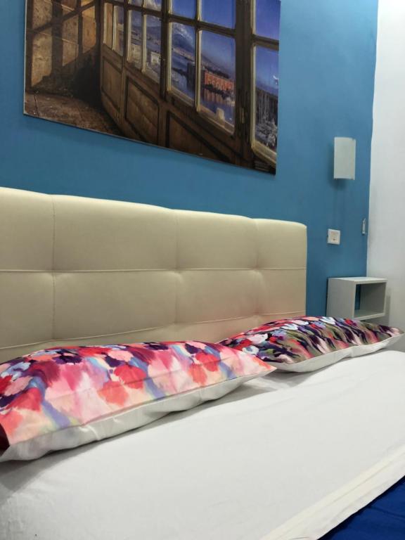 A bed or beds in a room at Decumani Prestige