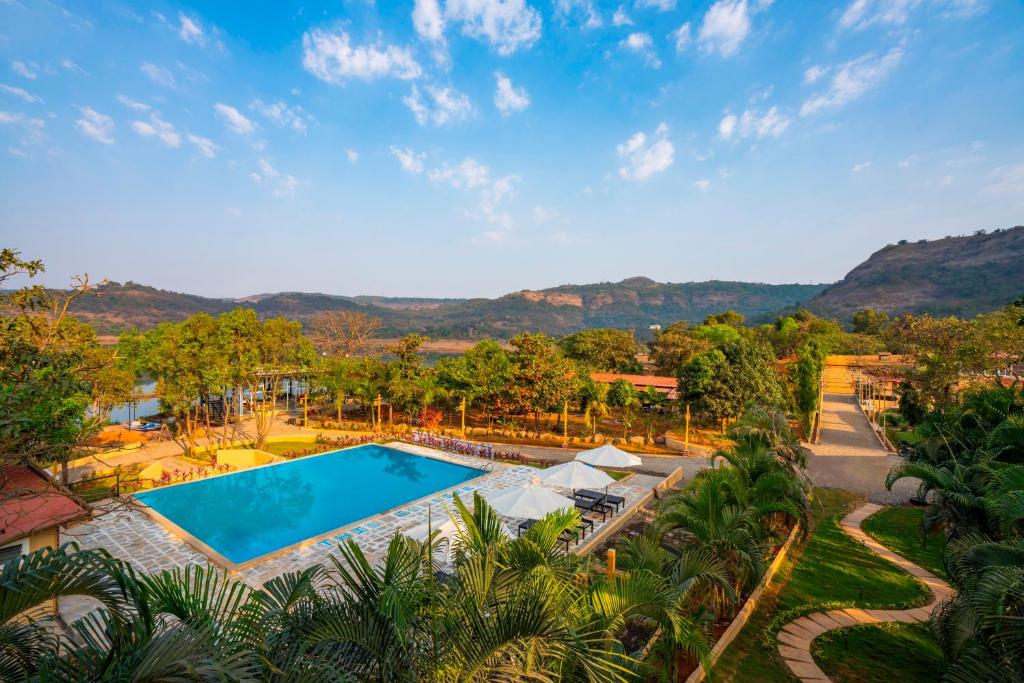 an aerial view of a resort with a swimming pool at Zostel Plus Lonavala in Lonavala