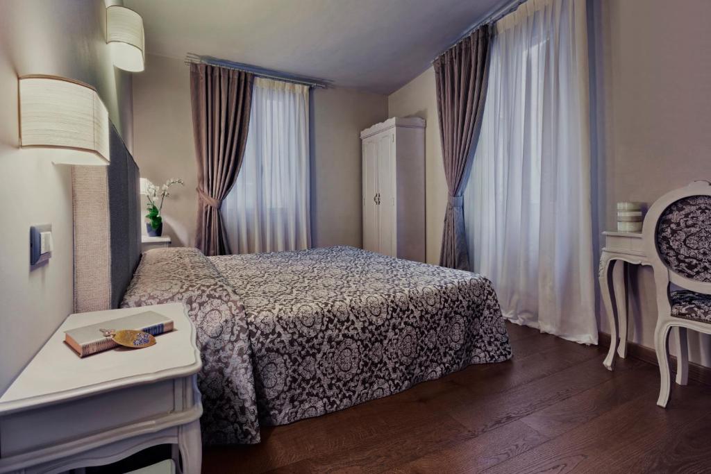 Postel nebo postele na pokoji v ubytování Locanda Fiorita