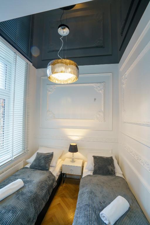 Posteľ alebo postele v izbe v ubytovaní Prestige Apartment Rynek Kielce
