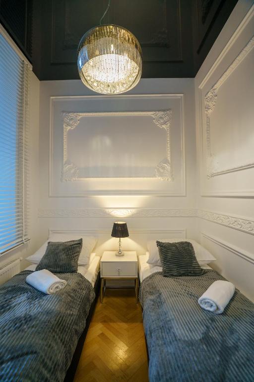 Posteľ alebo postele v izbe v ubytovaní Prestige Apartment Rynek Kielce