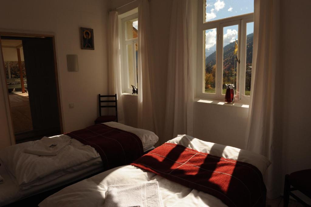 Postel nebo postele na pokoji v ubytování Grand Hotel Ushba