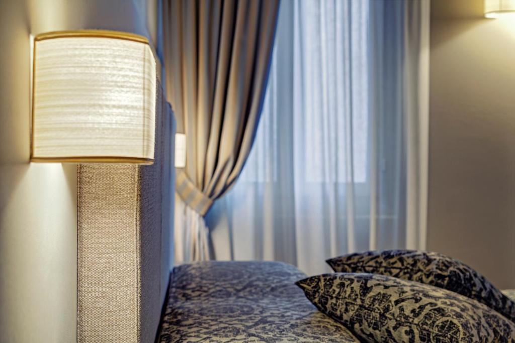 Postel nebo postele na pokoji v ubytování Locanda Fiorita