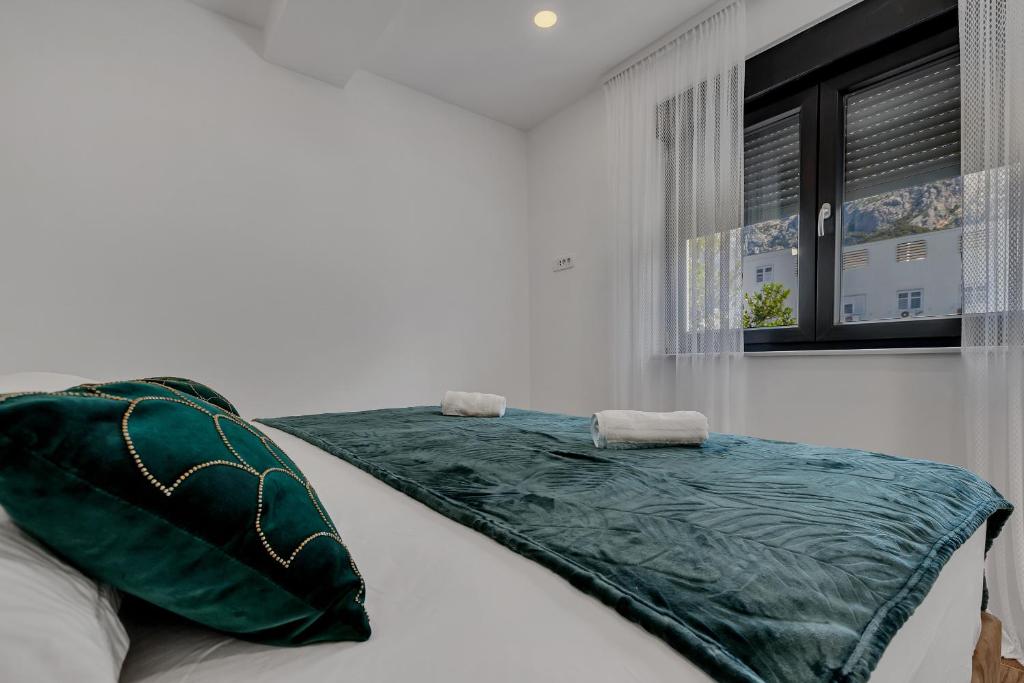 Postel nebo postele na pokoji v ubytování Laurus Makarska Accommodation