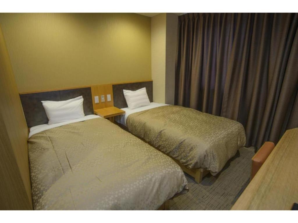 Hotel Relief SAPPORO SUSUKINO - Vacation STAY 22964vにあるベッド