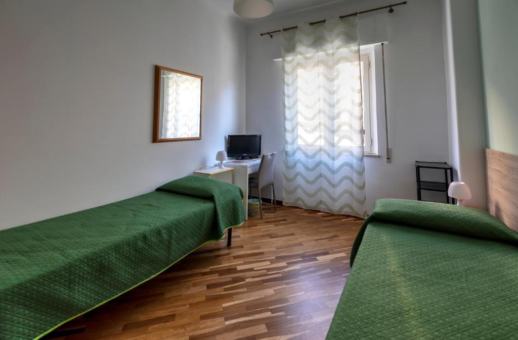 A bed or beds in a room at Ai Bastioni del Massimo