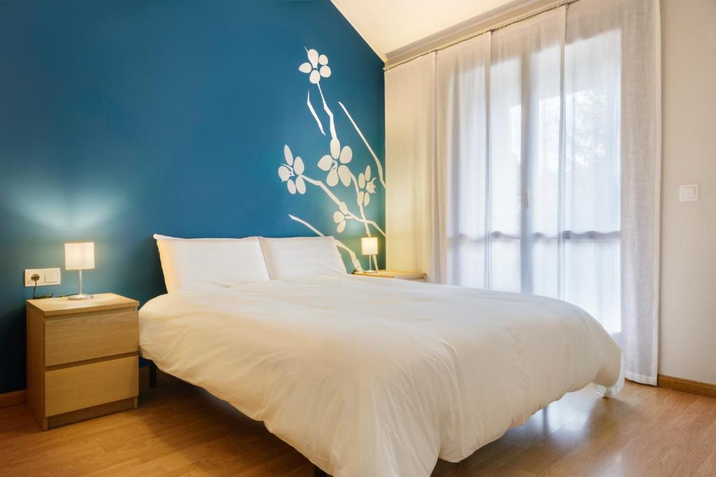 Postel nebo postele na pokoji v ubytování CASA CON JARDIN EN HECHO
