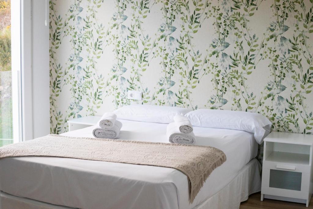 Postel nebo postele na pokoji v ubytování Hospedium Apartamentos Galitrips A Casa Da Reina
