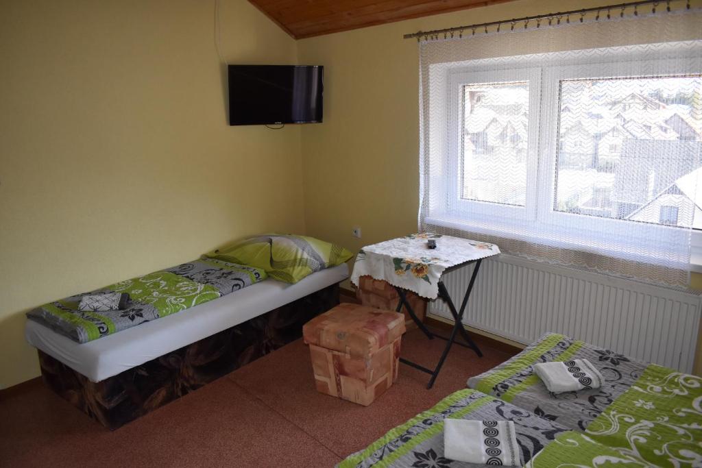 Postel nebo postele na pokoji v ubytování Penzion Janka