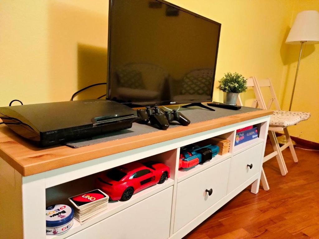 A television and/or entertainment centre at La Casa de Maia