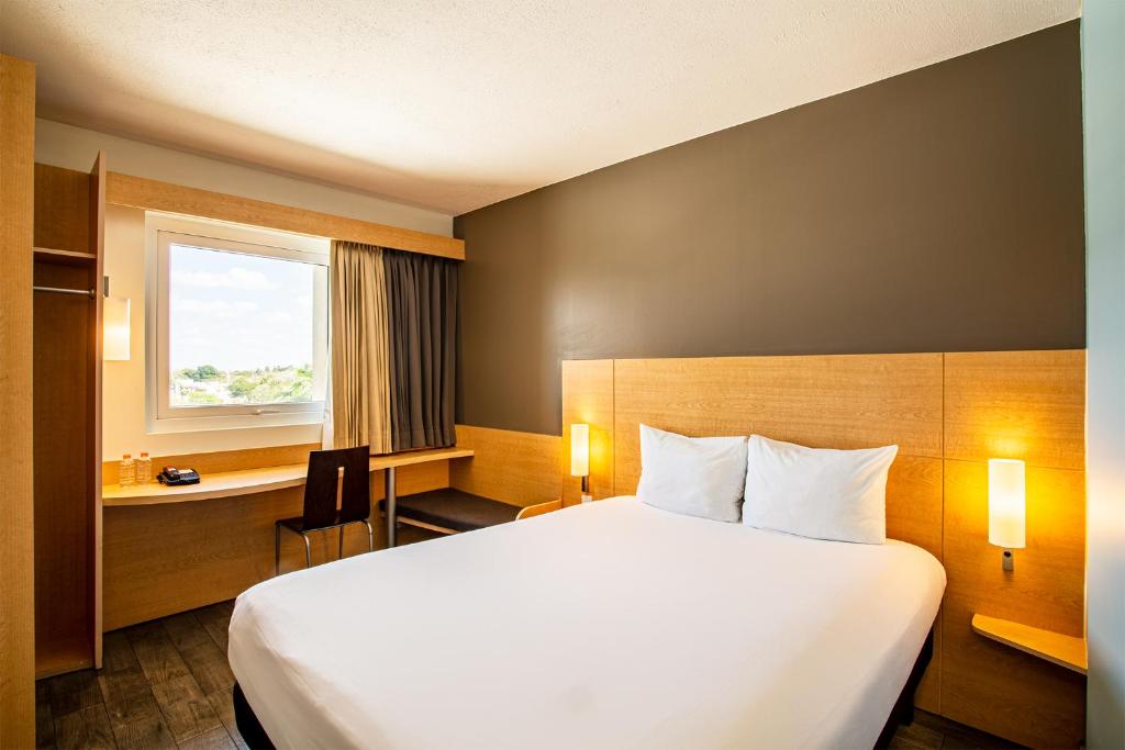 Cama o camas de una habitación en Ibis Merida