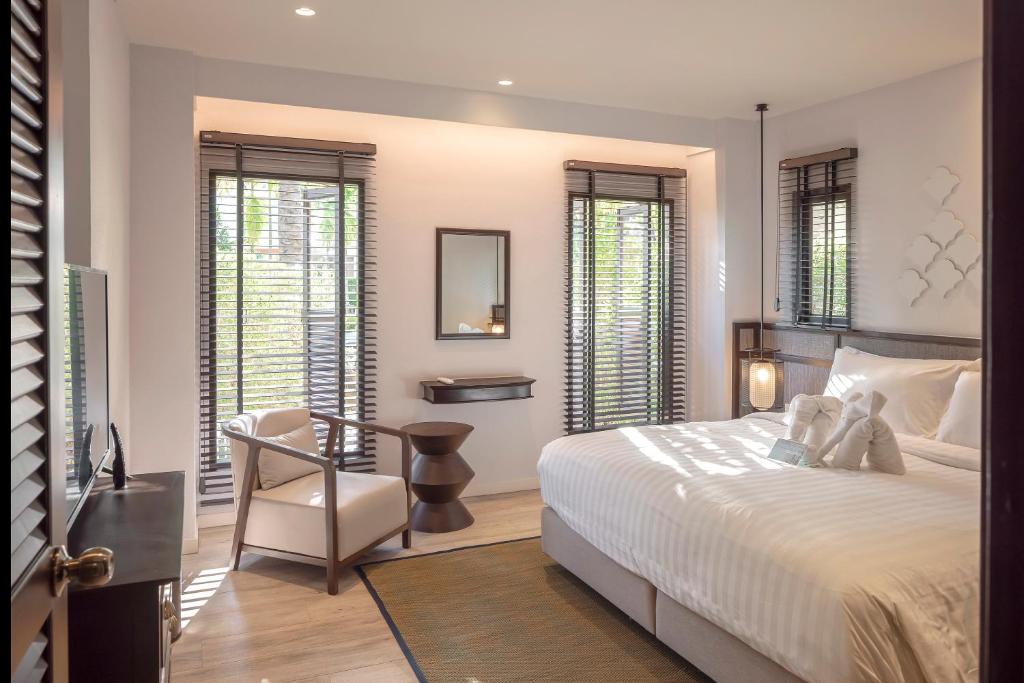 Postel nebo postele na pokoji v ubytování The Pe La Resort, Phuket - SHA Extra Plus