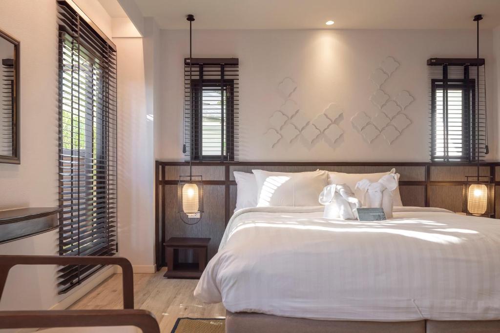 Postel nebo postele na pokoji v ubytování The Pe La Resort, Phuket - SHA Extra Plus