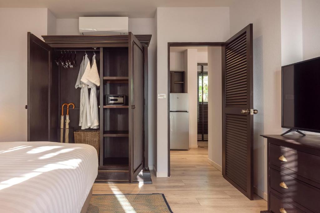 Postel nebo postele na pokoji v ubytování The Pe La Resort, Phuket - SHA Extra Plus