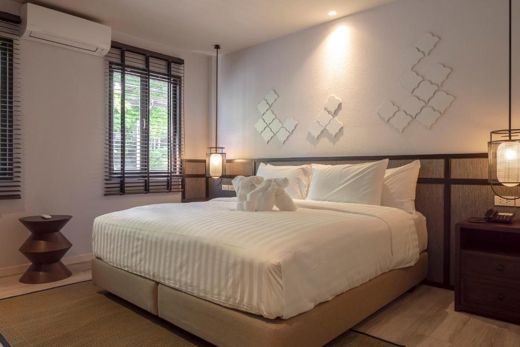 Postel nebo postele na pokoji v ubytování The Pe La Resort, Phuket - SHA Extra Plus