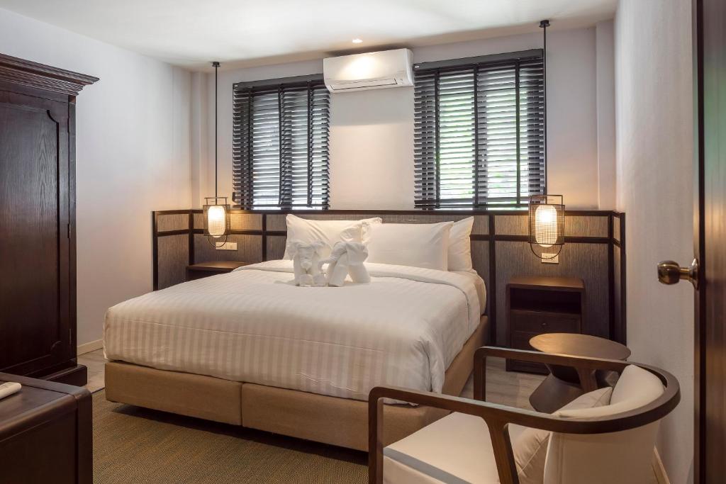 Postel nebo postele na pokoji v ubytování The Pe La Resort, Phuket - SHA Extra Plus