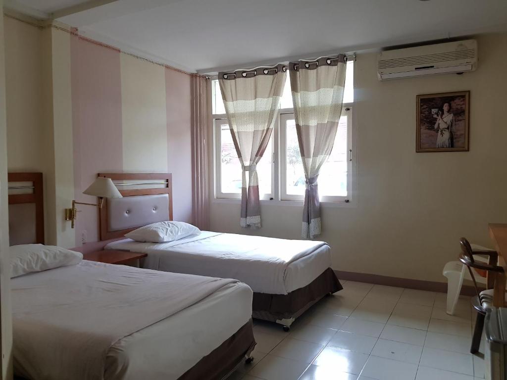 Postel nebo postele na pokoji v ubytování Casa Holiday Hotel SHA