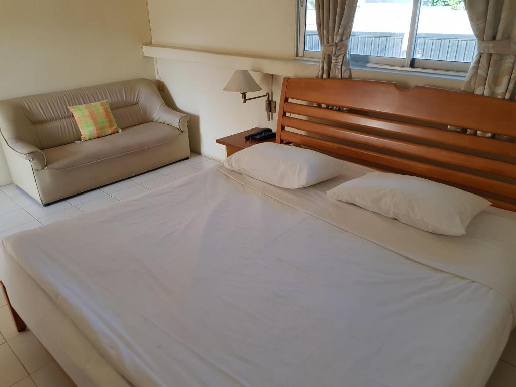 Postel nebo postele na pokoji v ubytování Casa Holiday Hotel SHA