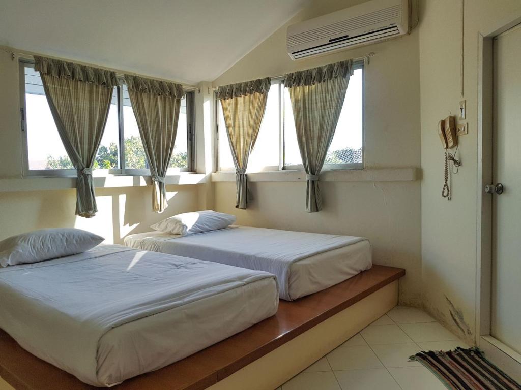 Postel nebo postele na pokoji v ubytování Casa Holiday Hotel SHA
