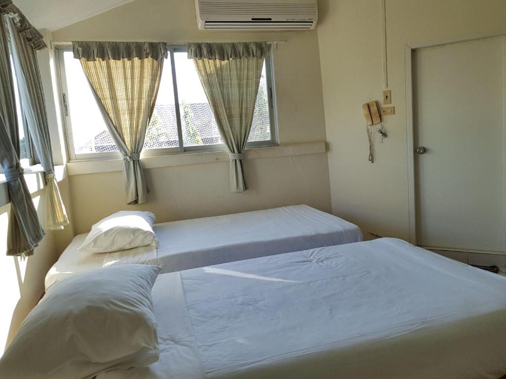 Postel nebo postele na pokoji v ubytování Casa Holiday Hotel SHA