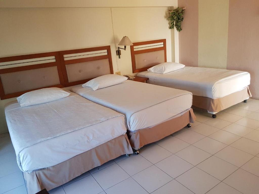 Postel nebo postele na pokoji v ubytování Casa Holiday Hotel SHA