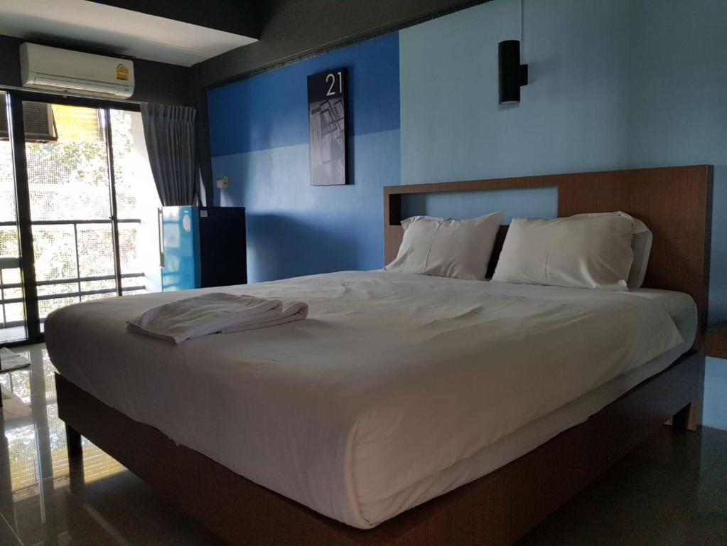Postel nebo postele na pokoji v ubytování Elite Residence Phitsanulok SHA