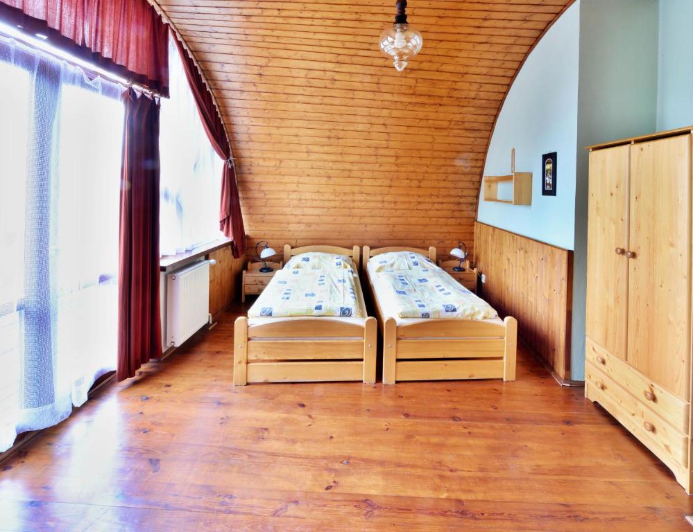 Postel nebo postele na pokoji v ubytování Penzion Uno