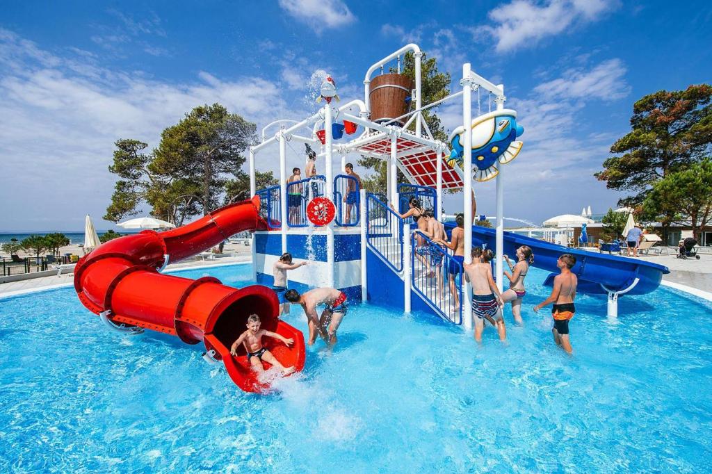 a group of people playing in a water park at Holiday resort Zaton Holiday Resort Zaton-Nin - CDN02044-CYB in Zaton