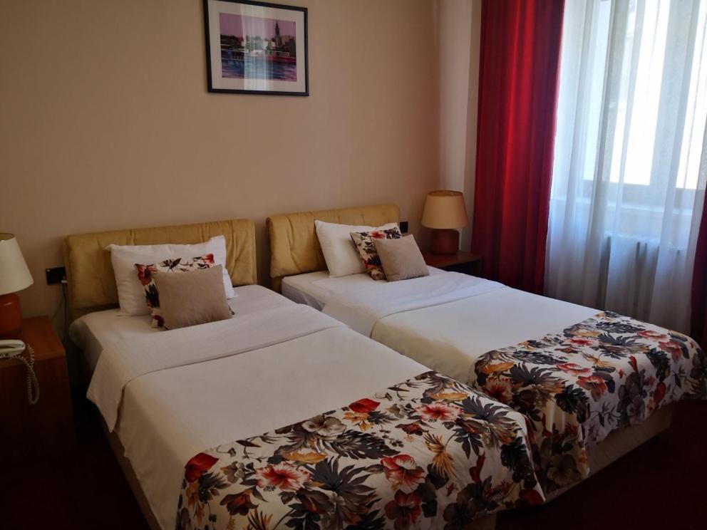 Postel nebo postele na pokoji v ubytování Hotel N