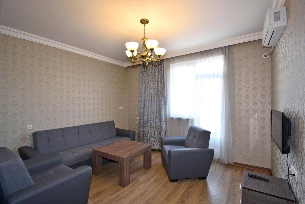 a living room with a couch and two chairs at Apartment for guest A2 in Yerevan