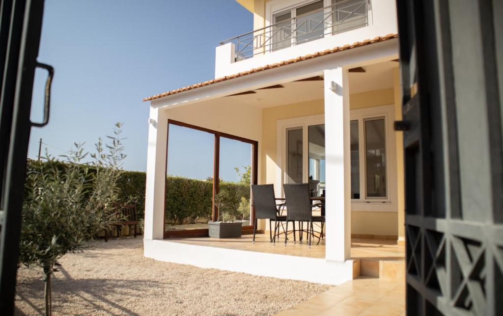 a view of a house with an open patio at Beach house 30 in Ialysos