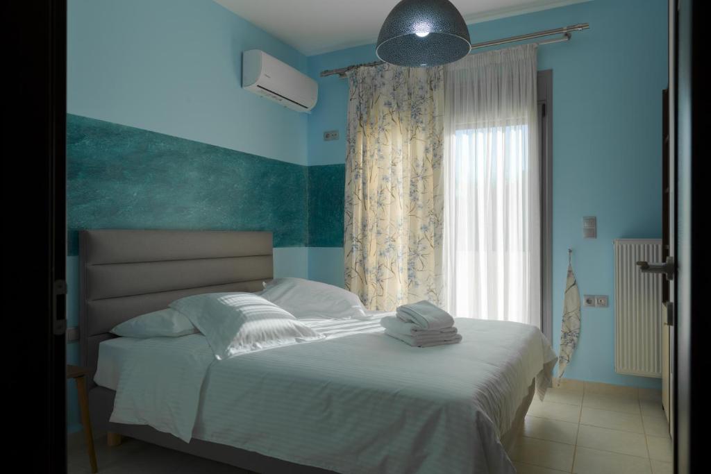 Postel nebo postele na pokoji v ubytování Palamoutaki Villa