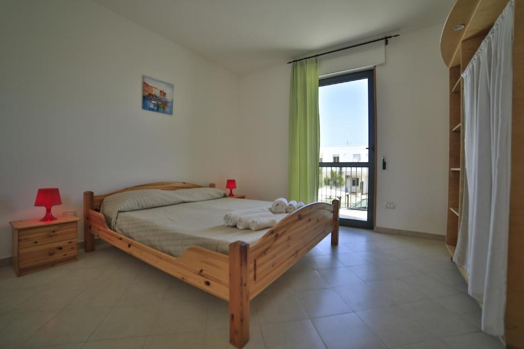 Postel nebo postele na pokoji v ubytování Residence Cala Verde
