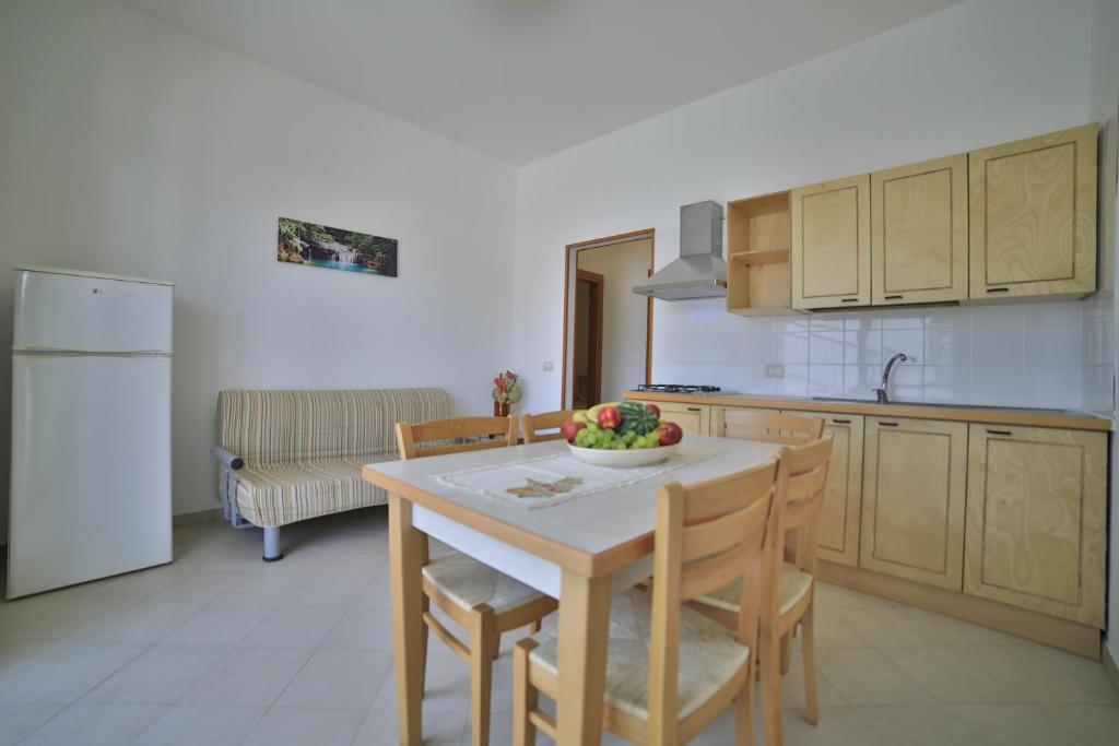 Kuchyň nebo kuchyňský kout v ubytování Residence Cala Verde