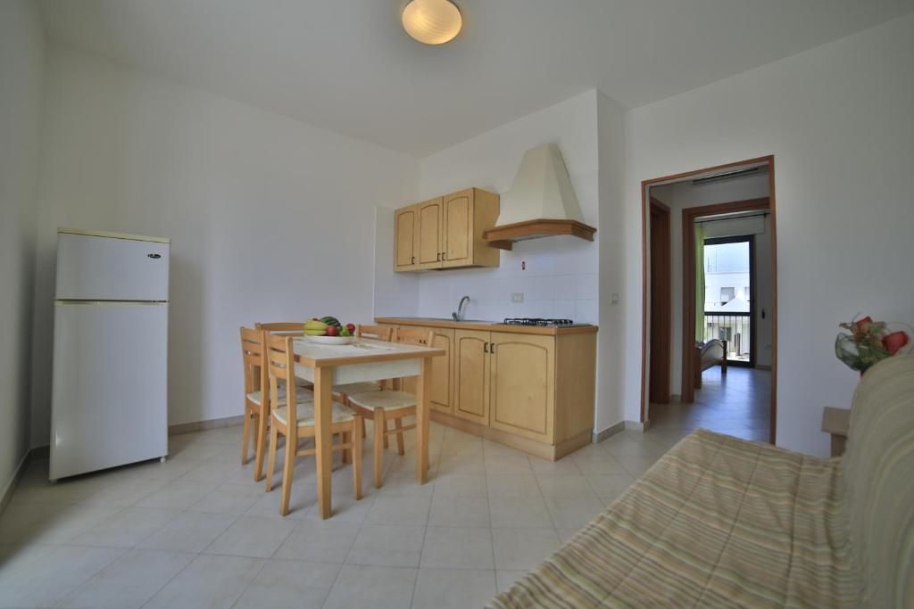 Kuchyň nebo kuchyňský kout v ubytování Residence Cala Verde